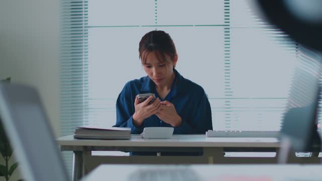 Beautiful business woman using smartphone texting sending emails successful female executive checking messages on mobile phone arriving at workplace.