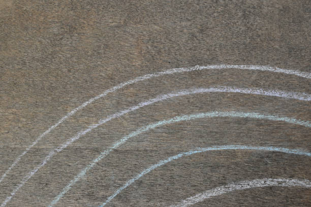 White chalk hand drawing in curve line shape on black board background