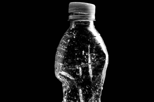 Plastic mineral water bottle on black background