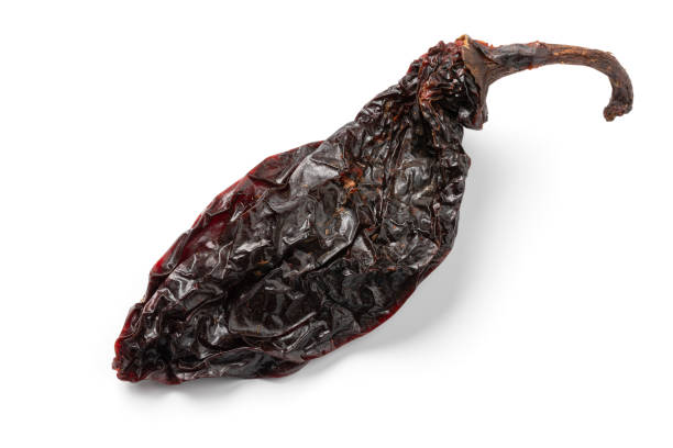 istock Single dried smoked Mexican chipotle pepper on white background close up 2091608267
