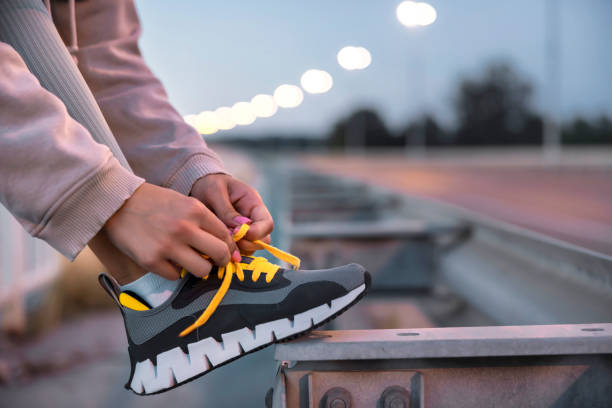 istock Woman tying shoelaces getting ready for morning jogging 2091639477