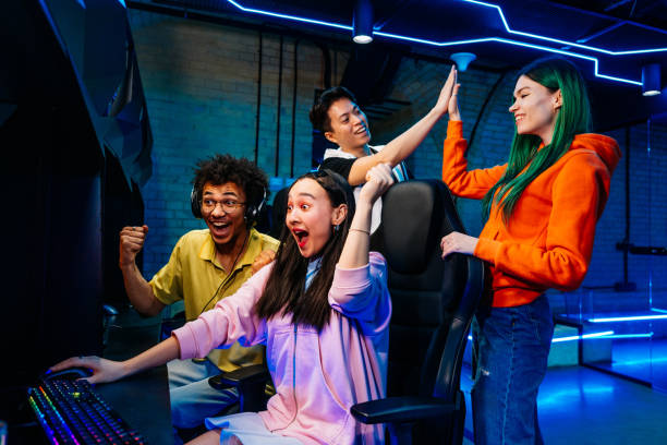 istock Multiethnic group of young friends playing videogames 2091643680