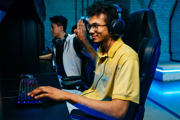 istock Multiethnic group of young friends playing videogames 2091645742