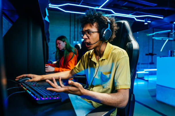 istock Multiethnic group of young friends playing videogames 2091649819