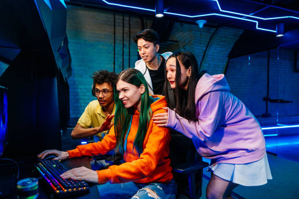 istock Multiethnic group of young friends playing videogames 2091650330