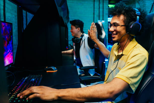 istock Multiethnic group of young friends playing videogames 2091650839
