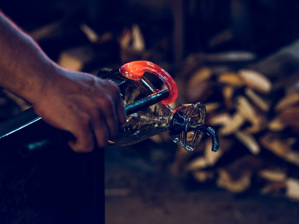 istock Anonymous craftsman making glass carafe in factory 2091655778
