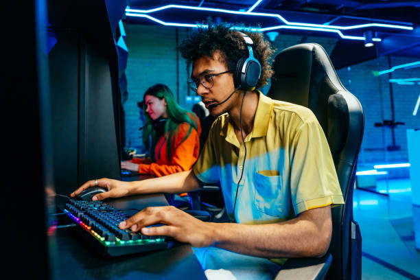 istock Multiethnic group of young friends playing videogames 2091661223