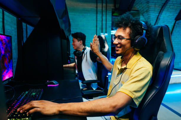 istock Multiethnic group of young friends playing videogames 2091662252