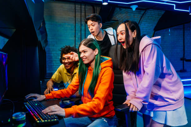 istock Multiethnic group of young friends playing videogames 2091665892