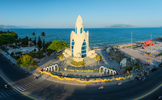 Drone view dragon dance by Tram Huong tower - with the longest dragon in Vietnam - Nha Trang city, Khanh Hoa province, central Vietnam