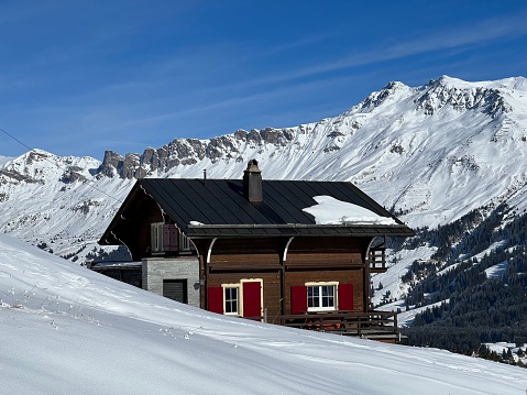 Swiss alpine holiday homes, mountain villas and holiday apartments in the winter ambience of the tourist resorts of Valbella and Lenzerheide in the Swiss Alps - Canton of Grisons, Switzerland (Kanton Graubünden, Schweiz)