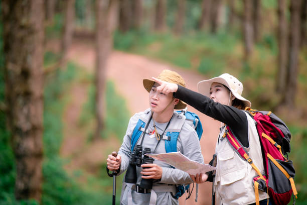 istock Hiking Couple backpacker in the pine forest. 2091713472