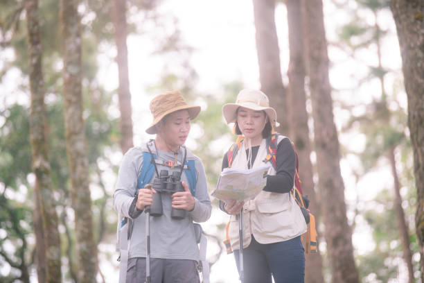 istock Hiking Couple backpacker in the pine forest. 2091714586