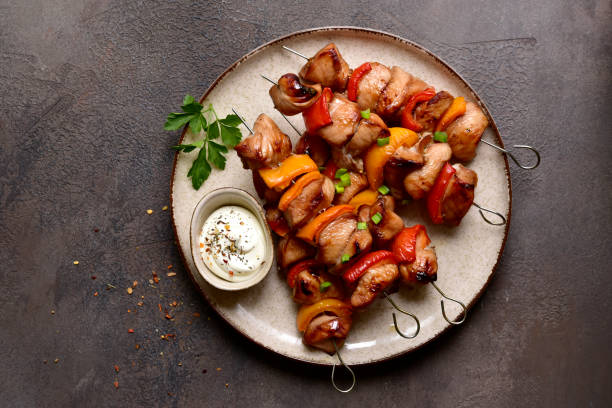 istock Grilled chicken skewer kebab with greek yogurt. Top view with copy space. 2091728462