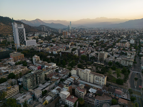 aerial view of Santiago during the sunrise with an office building in the foreground in Chile