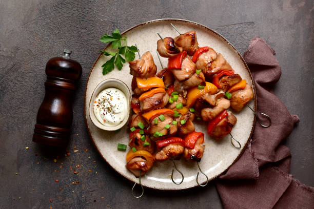 istock Grilled chicken skewer kebab with greek yogurt. Top view with copy space. 2091732119