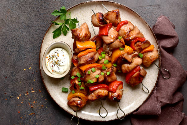 istock Grilled chicken skewer kebab with greek yogurt. Top view with copy space. 2091732120