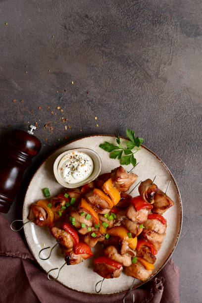 istock Grilled chicken skewer kebab with greek yogurt. Top view with copy space. 2091733727