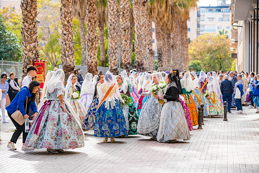 March 17, 2024 Valencia-Spain. Large group of women wearing traditional costume preparing for Las Fallas festivities in Valencia-Spain