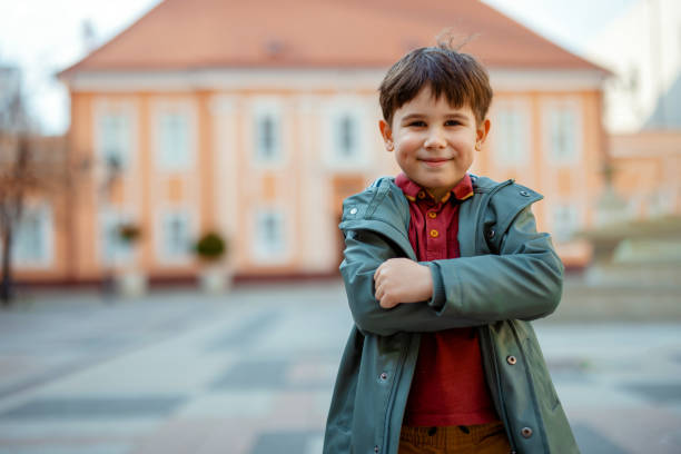 Portrait of Adorable Little Boy Looking at Camera Outdoors. Active Leisure for Kids Outdoors