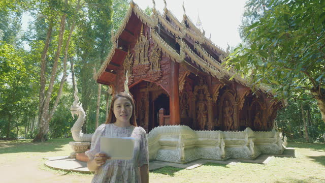 Woman tourist walk along entrance Wat Luang  Khun Win Chiangmai