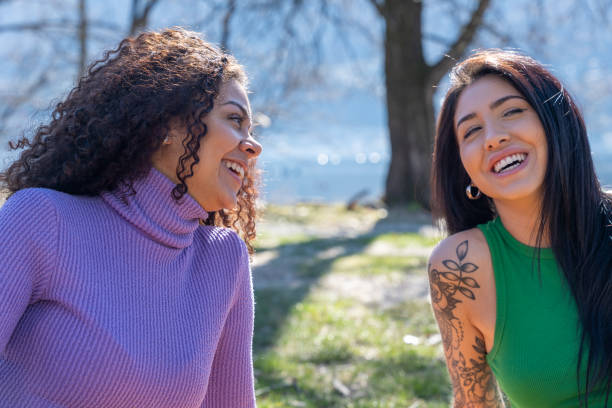istock Springtime Conversations: Friends Lounging in the Park 2091757191