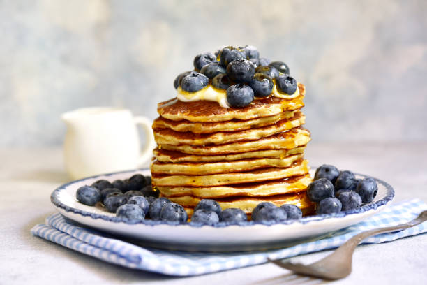 istock Stack of fresh hot pancakes with maple syrup and blueberries. 2091768573