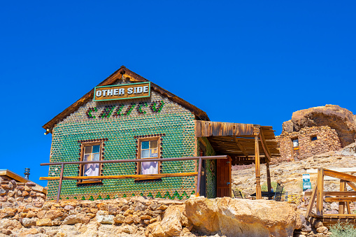 Calico Ghost Town,  California, United States - October 6, 2023: green bottle house