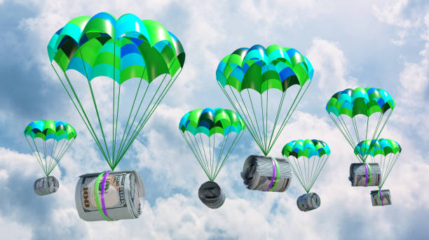 istock dollars attached to a parachute against the sky 2091842378