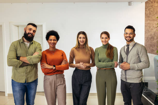 istock Successful group of business people at modern office looking at camera. 2091856328