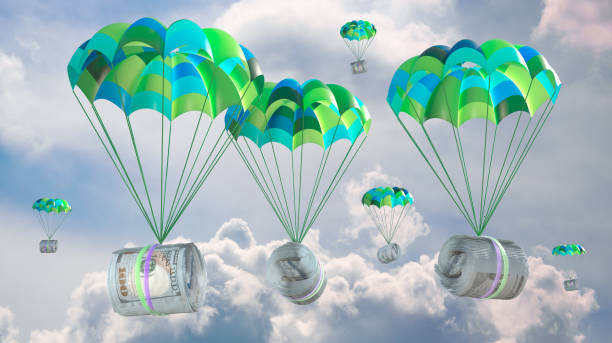istock dollars attached to a parachute against the sky 2091856338