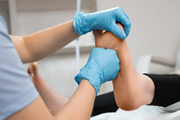 istock Masseur doing a professional foot massage in beauty salon 2091868985