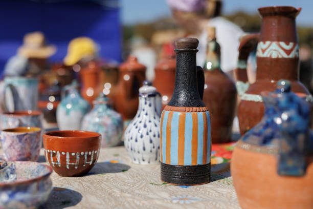 Handmade clay dishes are sold at the fair