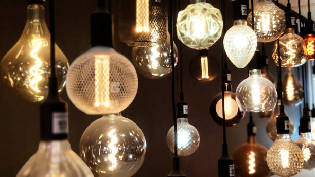 Close-Up of Illuminated Pendant Lights Hanging From Ceiling