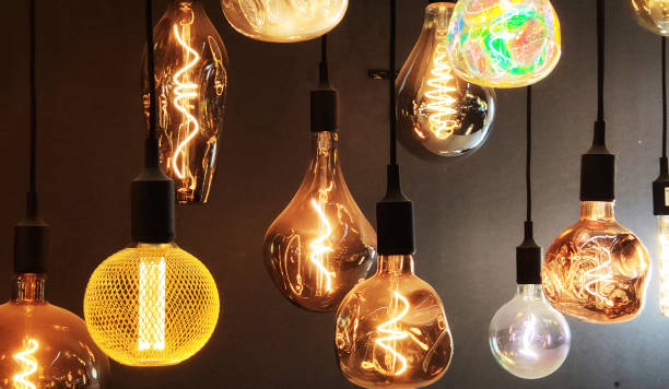 istock Close-Up of Illuminated Pendant Lights Hanging From Ceiling 2091964087