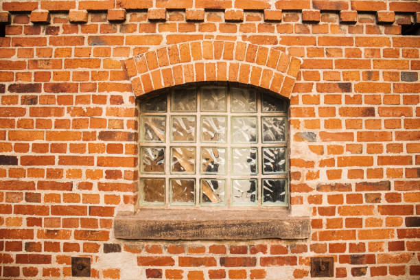 Windows  on a red brick wall.