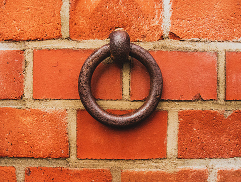 Old iron ring in the brick wall to tie horses or cattle,Hitching Post Ring Horse