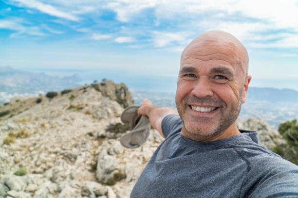 istock Smiling hiker takes a selfie enjoy hiking 2092009615