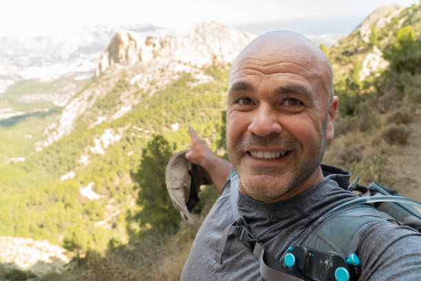 istock Smiling hiker takes a selfie enjoy hiking 2092009621