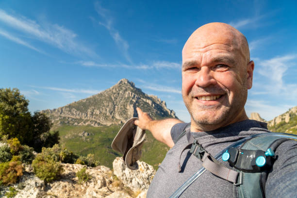 istock Smiling hiker takes a selfie enjoy hiking 2092009623