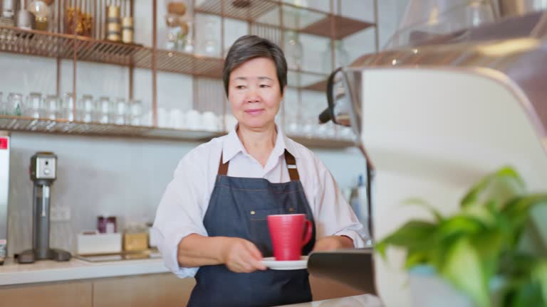 elderly woman operate coffee machine