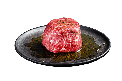 hot fresh grilled boneless rib eye steak isolated on white with barbecue grill marks in the meat