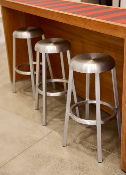 istock Group of metal barstools with a brushed nickel finish 2092057186