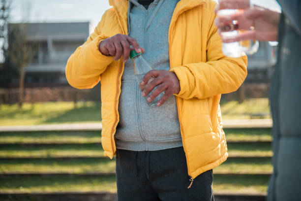 Close-Up Of Man Holding Sparkler At Night
