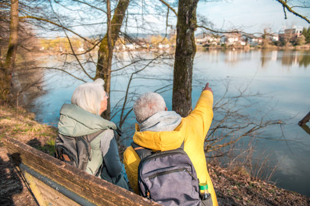 istock Active Senior Couple Enjoying Nature by the Lakeside 2092134487