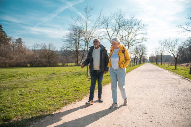 istock Active Senior Couple Walking Together Outdoors 2092134497