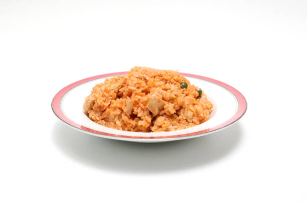 A white square bowl with a serving of jasmine rice in the shape of a heart.