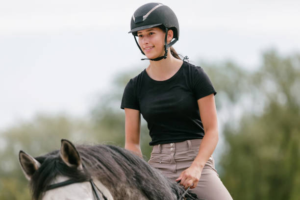 istock Horseback riding along the trail between wood fences and fields 2092150701