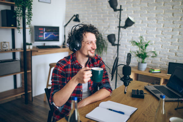 istock Young man recording a podcast 2092168460